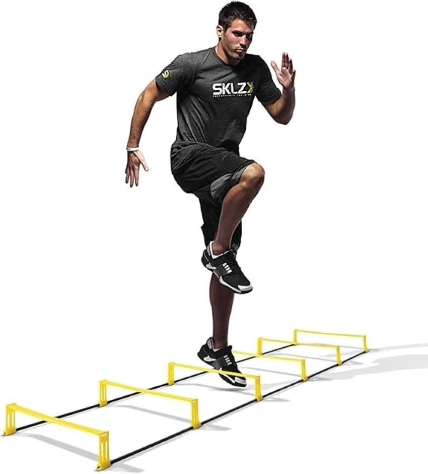 Athlete practicing quick footwork on SKLZ speed and agility ladder.